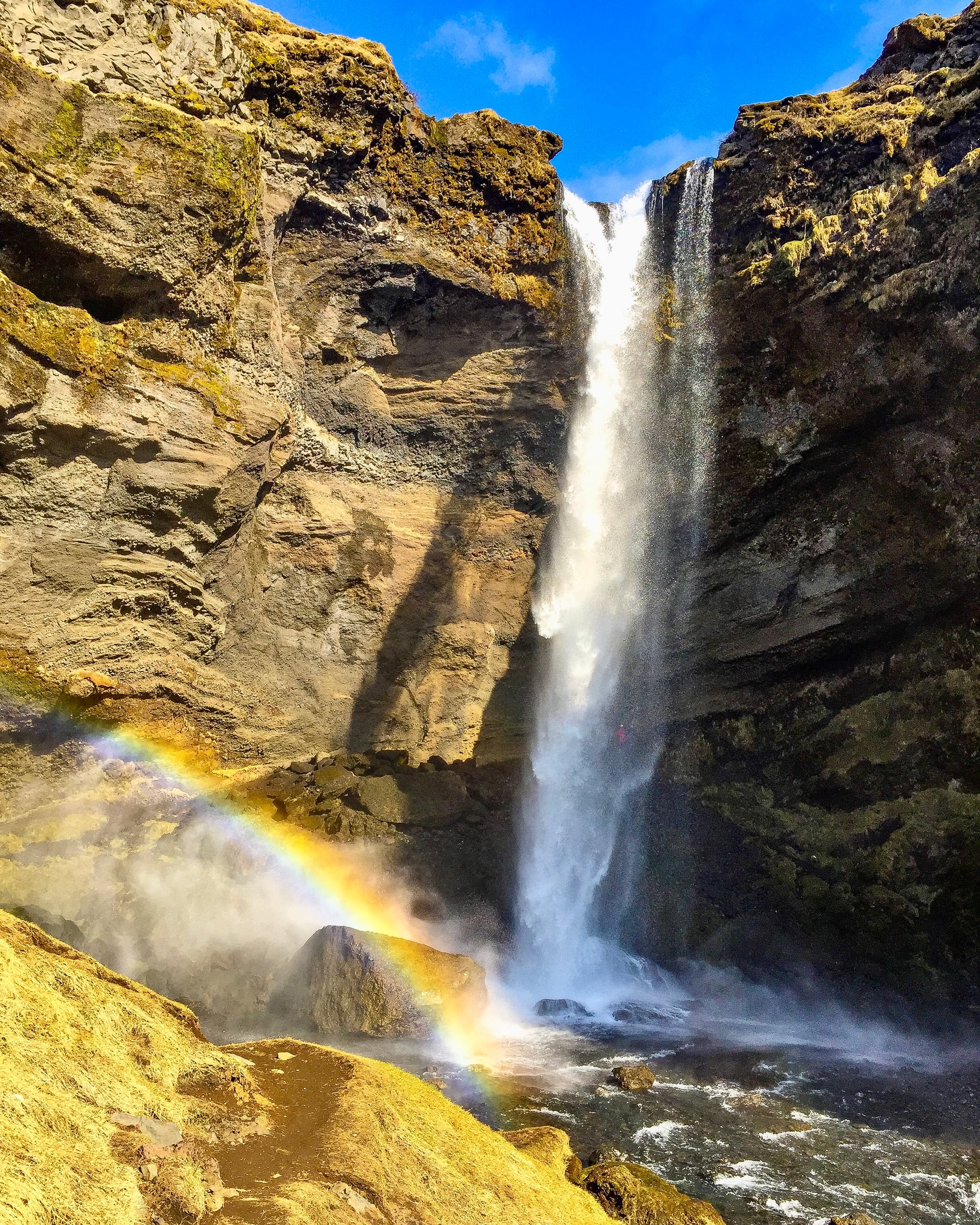 Kvernufoss waterfall with rainbow in South Iceland