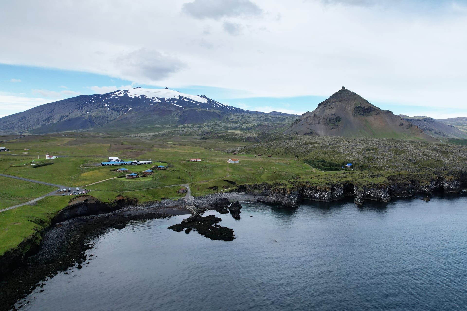 Hellnar village with Snæfellsjökull in the background on the Snæfellsnes Peninsula in Iceland