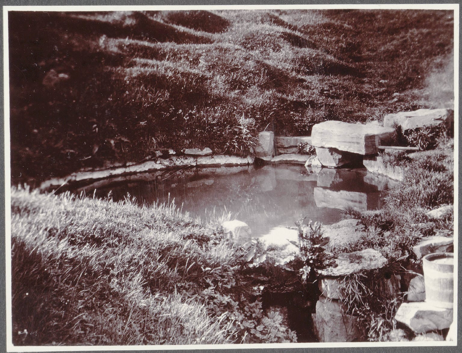 Historic Snorralaug pool in Reykholt, West Iceland